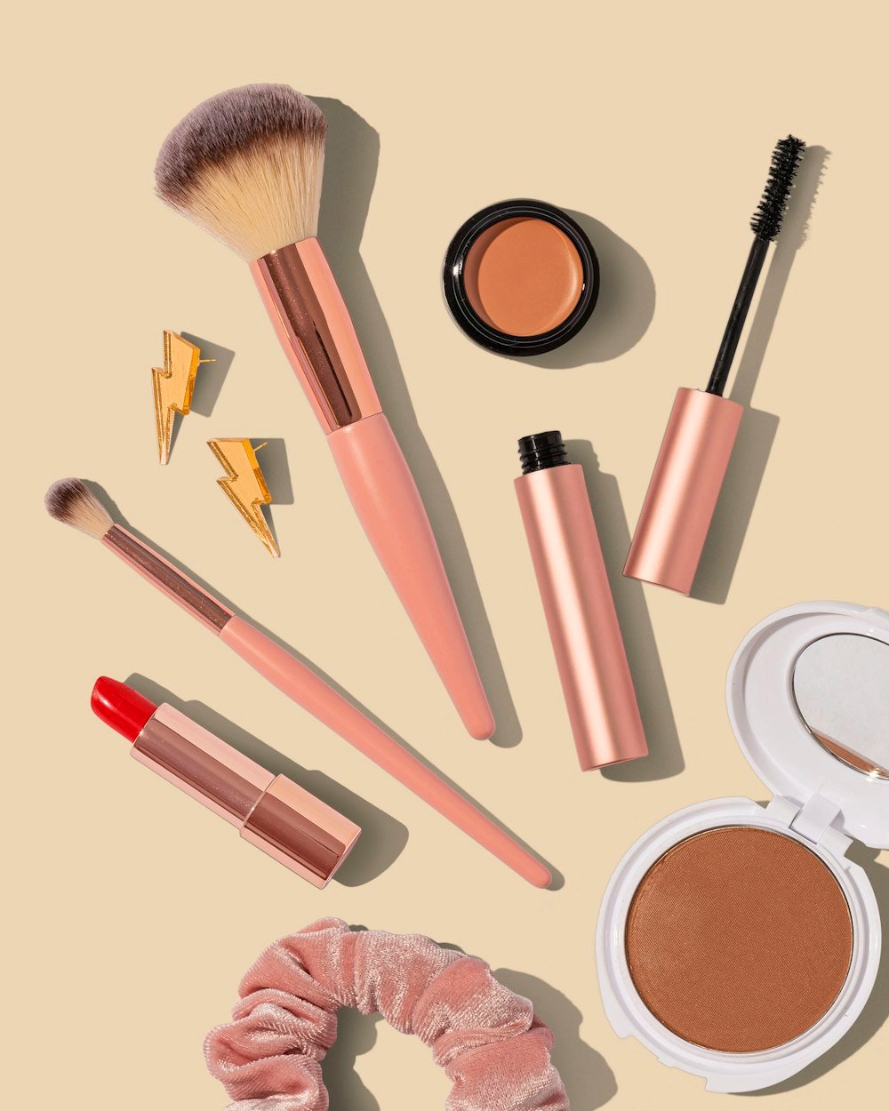 Set of makeup brushes arranged on a surface