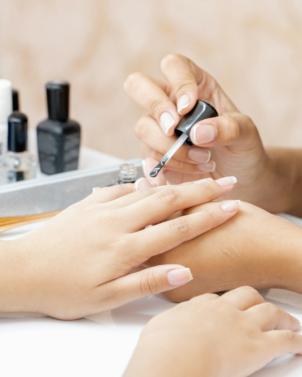 Close detail of a manicure being applied