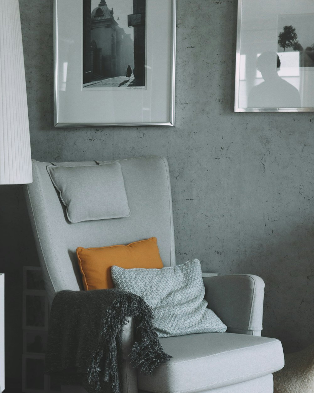 Armchair and lamp in a softly lit corner