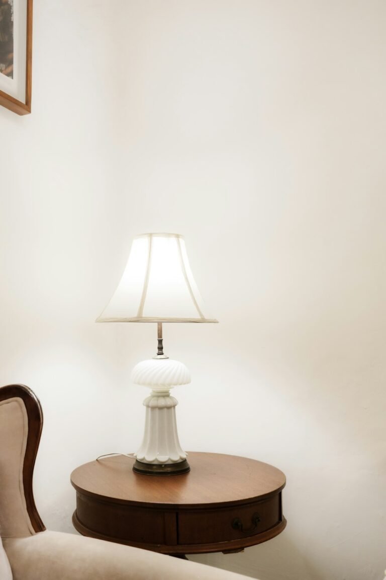 Warm lamp lighting a cosy living room corner